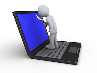 Image showing Person with magnifier on laptop