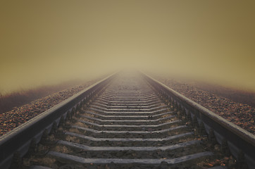 Image showing grunge railroad to horizon in fog