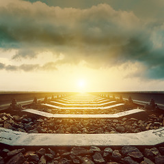 Image showing railroad closeup to sunset in clouds