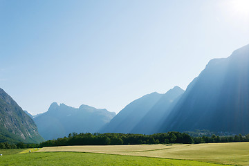 Image showing Sun rays in mountains lighting the valley, Norway