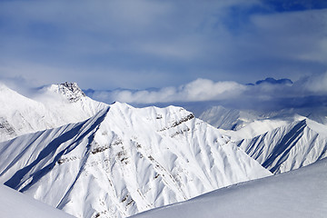 Image showing Off-piste slope and cloudy mountains at nice evening