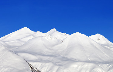 Image showing Snowy mountains and blue sky at nice day
