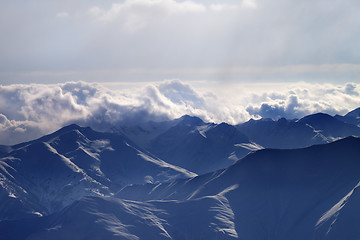 Image showing Silhouette of evening mountains in fog