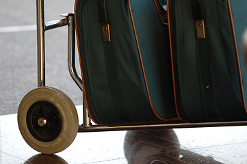 Image showing Suitcases on a cart