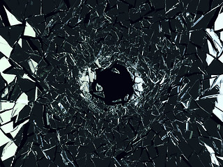 Image showing Shattered black glass: sharp Pieces and hole 