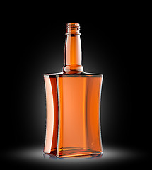 Image showing Red glass bottle for cognac or whisky