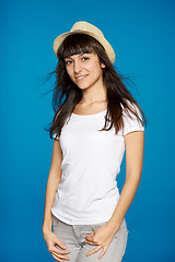 Image showing Smiling carefree woman wearing white straw hat