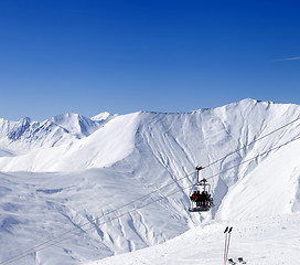 Image showing Skiers on ropeway at ski resort Gudauri