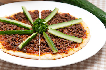 Image showing Turkish beef pizza with cucumber on top