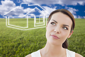 Image showing Woman and Grass Field with Ghosted House Figure Behind