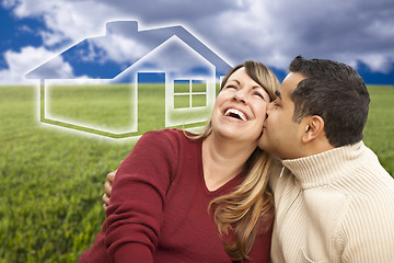 Image showing Happy Couple Sitting in Grass Field with Ghosted House Behind