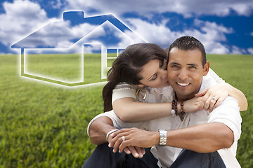 Image showing Hispanic Couple Sitting in Grass Field with Ghosted House Behind