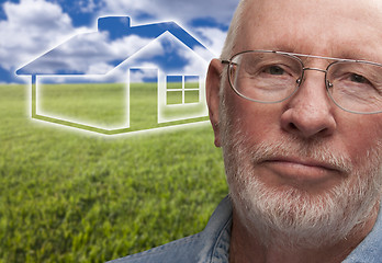 Image showing Melancholy Senior Man with Grass Field and Ghosted House Behind