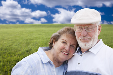 Image showing Loving Senior Couple Standing in Grass Field 