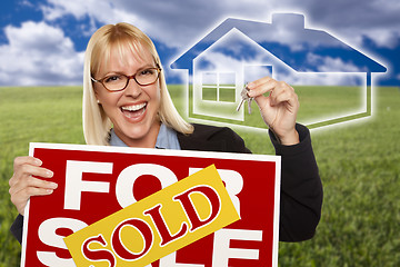 Image showing Woman with Sold For Sale Sign, Keys and Ghosted House