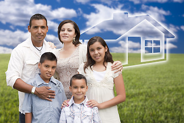 Image showing Hispanic Family Standing in Grass Field with Ghosted House Behin