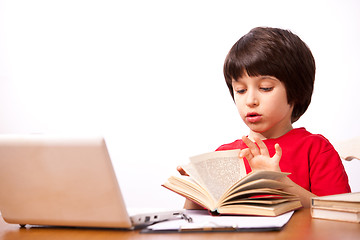 Image showing child reading a textbook