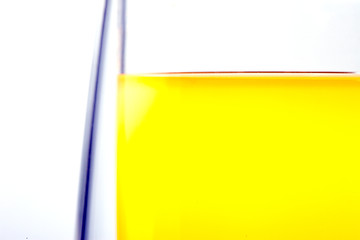 Image showing edge of a glass with a drink on a white background