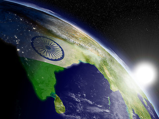 Image showing Sunrise over India with flag