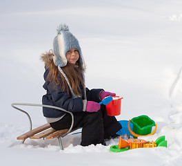 Image showing Little girl playing in snow