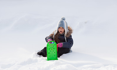 Image showing Little girl playing in snow