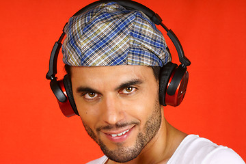 Image showing 30 years old man with beret and earphones