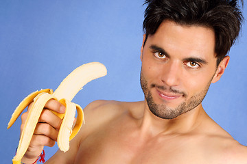 Image showing Handsome man with banana