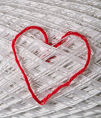 Image showing Knitted red heart on white