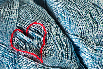 Image showing Knitted red heart on blue