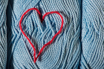 Image showing Knitted red heart on blue