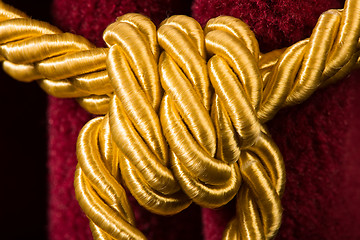 Image showing Red velvet curtain with tassel