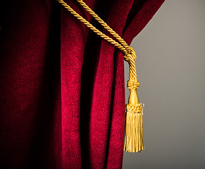 Image showing Red velvet curtain with tassel