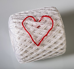 Image showing Knitted red heart on white