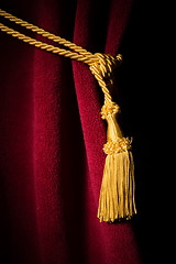 Image showing Red velvet curtain with tassel