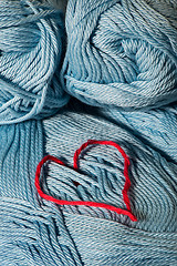 Image showing Knitted red heart on blue