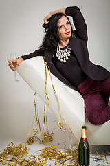 Image showing Seductive brunette holding a glass of champagne