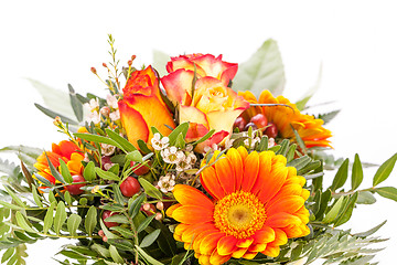 Image showing Vivid orange gerbera daisy in a bouquet