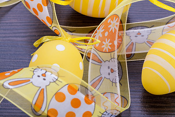 Image showing Decorative Easter eggs, on a rustic wooden table