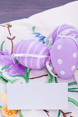 Image showing colorful easter egg decoration on wooden background