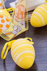 Image showing Decorative Easter eggs, on a rustic wooden table