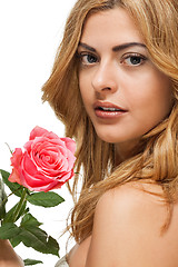 Image showing attractive young smiling woman with flowers roses isolated