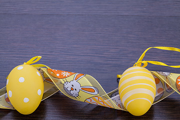 Image showing Decorative Easter eggs, on a rustic wooden table