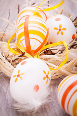 Image showing Decorative Easter eggs, on a rustic wooden table