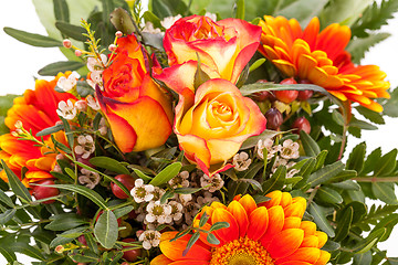 Image showing Vivid orange gerbera daisy in a bouquet