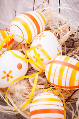 Image showing Decorative Easter eggs, on a rustic wooden table