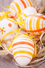 Image showing Decorative Easter eggs, on a rustic wooden table