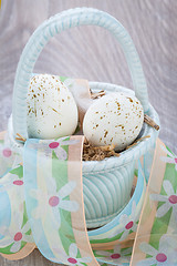 Image showing Three natural blue Easter eggs in a basket