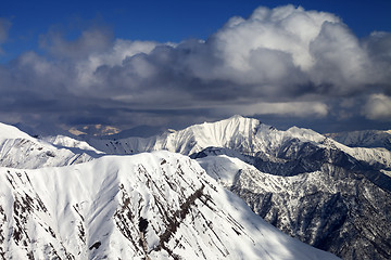 Image showing Snowy ridges with trace from avalanche