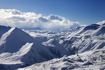 Image showing Speed flying in sunny winter mountains