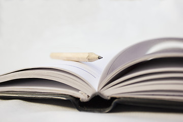 Image showing Pencil on a book